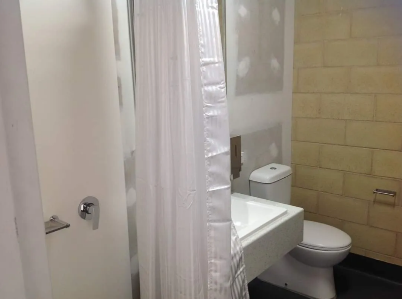 Completed bathroom amenities block with shower and toilet